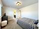 Bedroom with plaid bedding and a view to hallway at 4525 Cholla Trl, Castle Rock, CO 80104