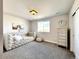 Bedroom with daybed, dresser, and window at 4525 Cholla Trl, Castle Rock, CO 80104
