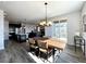 Open concept dining area with a wooden table and access to deck at 4525 Cholla Trl, Castle Rock, CO 80104