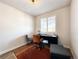 Bright home office with a desk, chair, ottoman, and area rug at 4525 Cholla Trl, Castle Rock, CO 80104