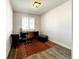 Bright home office with a desk, chair, ottoman, and area rug at 4525 Cholla Trl, Castle Rock, CO 80104