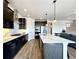 Spacious kitchen featuring dark cabinetry and an island at 4525 Cholla Trl, Castle Rock, CO 80104