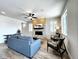 Living room with stone fireplace, hardwood floors, and comfortable seating area at 4525 Cholla Trl, Castle Rock, CO 80104