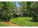 Picturesque view of a serene creek flowing through lush greenery, creating a tranquil and natural landscape at 8039 Lee Dr # 2, Arvada, CO 80005