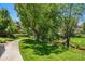Picturesque walking path and lush greenery near running creek in the community at 8039 Lee Dr # 2, Arvada, CO 80005