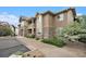 A three-story building featuring stone accents, light-colored siding and awnings over the windows at 8039 Lee Dr # 2, Arvada, CO 80005