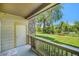 View from the patio of the yard with two benches and a large tree on a sunny day at 8039 Lee Dr # 2, Arvada, CO 80005