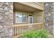 Charming patio with stone accents, inviting space for relaxing outdoors or enjoying a morning cup of coffee at 8039 Lee Dr # 2, Arvada, CO 80005