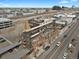 A street level view of the city with visible parking, surrounding buildings, and rooftop patio at 2715 Blake St # 304, Denver, CO 80205