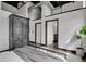 Bright bedroom featuring a wardrobe and easy access to the bathroom at 2715 Blake St # 304, Denver, CO 80205