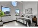 Bedroom featuring bright natural light from large windows, neutral colors, and simple decor at 2715 Blake St # 304, Denver, CO 80205