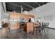 Contemporary kitchen featuring sleek cabinetry, stainless steel appliances, and a center island with seating at 2715 Blake St # 304, Denver, CO 80205