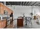 Modern kitchen showcasing stainless steel appliances, granite countertops, and a convenient island with bar seating at 2715 Blake St # 304, Denver, CO 80205