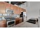 Well-equipped kitchen with stainless steel appliances, granite countertops, and ample cabinet space at 2715 Blake St # 304, Denver, CO 80205