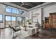 Bright living room featuring an open floor plan, spiral staircase, and city views at 2715 Blake St # 304, Denver, CO 80205