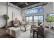 Bright living room featuring an open floor plan, modern seating, and exposed ceiling at 2715 Blake St # 304, Denver, CO 80205