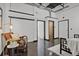 The living room features an open floor plan, exposed ceiling, and plenty of space with natural light at 2715 Blake St # 304, Denver, CO 80205
