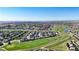 Beautiful aerial view of a home nestled in a golf course neighborhood at 15920 Buffalo Run Dr, Commerce City, CO 80022
