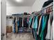 Walk-in closet equipped with shelving and ample hanging storage space at 15920 Buffalo Run Dr, Commerce City, CO 80022