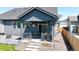 Covered patio with outdoor seating, providing a cozy spot for relaxation and entertaining at 15920 Buffalo Run Dr, Commerce City, CO 80022