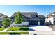 Charming two-story home with a well-manicured lawn, three-car garage and beautiful landscaping at 15920 Buffalo Run Dr, Commerce City, CO 80022