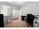 Bright home office with French doors, neutral carpet, and ample space for a productive workspace at 15920 Buffalo Run Dr, Commerce City, CO 80022