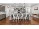 Bright kitchen with a large island, stainless steel appliances, modern cabinets, and sleek design elements at 15920 Buffalo Run Dr, Commerce City, CO 80022