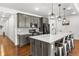 Stylish kitchen featuring a spacious island, stainless steel appliances, and designer backsplash at 15920 Buffalo Run Dr, Commerce City, CO 80022