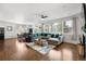 Spacious open-concept living space with lots of natural light, hardwood floors, and cozy seating at 15920 Buffalo Run Dr, Commerce City, CO 80022