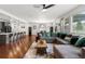 Bright and airy living space featuring an open floor plan with a seamless flow into the kitchen at 15920 Buffalo Run Dr, Commerce City, CO 80022