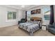 Relaxing main bedroom with large windows, decorative lighting and carpeted floor at 15920 Buffalo Run Dr, Commerce City, CO 80022