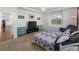 Main bedroom featuring large windows, recessed lighting and neutral colored carpet at 15920 Buffalo Run Dr, Commerce City, CO 80022