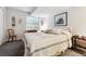 Bedroom with a bed, dresser, and a large window at 3145 Stevens Cir, Erie, CO 80516