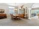 Formal dining room with large wood table, decorative accents and adjoining room at 3145 Stevens Cir, Erie, CO 80516