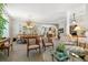 Spacious dining and living area with plush carpeting, neutral colors and traditional furnishings at 3145 Stevens Cir, Erie, CO 80516