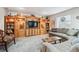 Cozy living room featuring a large built-in entertainment center and comfortable seating at 3145 Stevens Cir, Erie, CO 80516