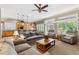 Spacious living room with a view to the kitchen with a breakfast bar and comfortable seating at 3145 Stevens Cir, Erie, CO 80516