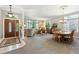 Open-concept living area featuring a dining room, large windows, and comfortable seating at 3145 Stevens Cir, Erie, CO 80516