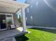 The back patio offers a cozy outdoor retreat with a sliding glass door and green lawn at 10092 Flower St, Broomfield, CO 80021