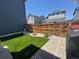 The backyard features lush lawn, a wood fence, pavers, and tasteful landscaping at 10092 Flower St, Broomfield, CO 80021