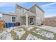 Covered patio, grassy yard, and space for grilling at 10092 Flower St, Broomfield, CO 80021