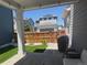 A view of a well-maintained backyard with green grass, a wood fence, and stone pavers at 10092 Flower St, Broomfield, CO 80021
