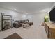 Finished basement with sectional sofa and large TV at 10092 Flower St, Broomfield, CO 80021