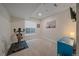 Basement with stationary bike and home office space at 10092 Flower St, Broomfield, CO 80021