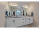 Elegant bathroom with double vanity and granite countertop at 10092 Flower St, Broomfield, CO 80021