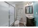 Basement bathroom with shower and dark vanity at 10092 Flower St, Broomfield, CO 80021