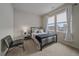 Bright bedroom with a metal bed frame and neutral decor at 10092 Flower St, Broomfield, CO 80021