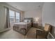 Cozy bedroom featuring a wooden bed frame and neutral decor at 10092 Flower St, Broomfield, CO 80021