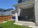 A covered patio offers a perfect outdoor living space with seating and shade at 10092 Flower St, Broomfield, CO 80021