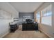 Bright home office with large windows and built-in shelving at 10092 Flower St, Broomfield, CO 80021